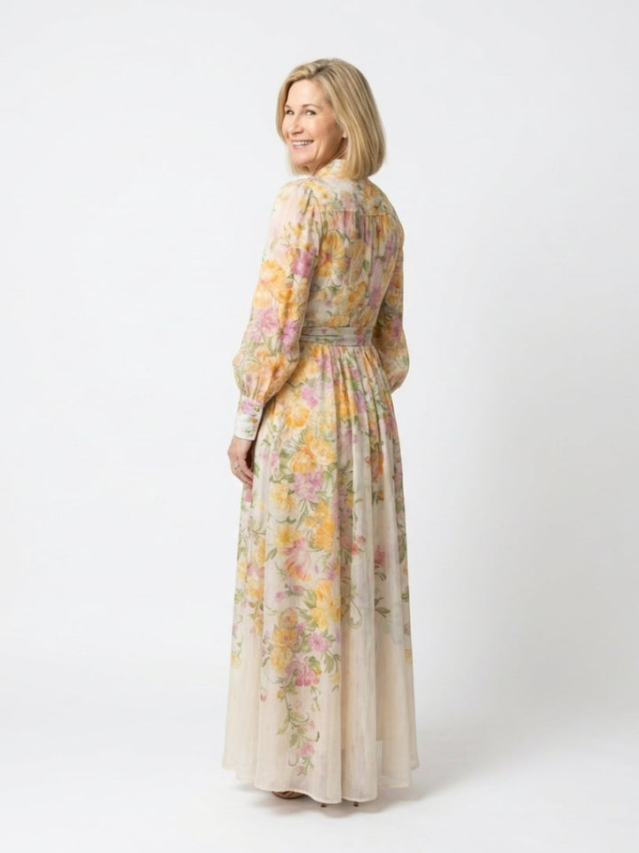 Close-up of the romantic botanical floral print on the Felicity yellow maxi dress