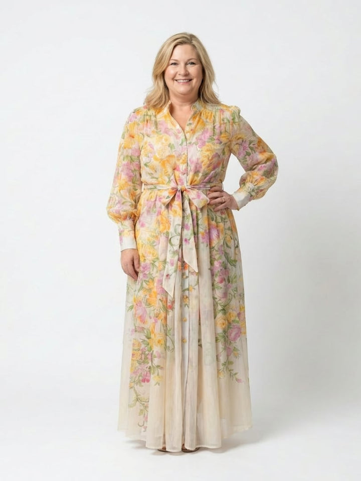 Back view of the Felicity yellow floral long sleeve maxi dress showing elegant drape
