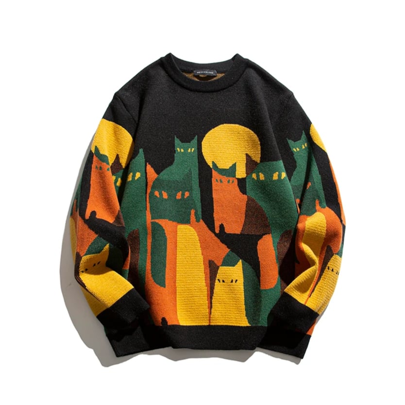 Animated detail view of the Moonlit Cat Sweater highlighting the moonlit cat graphic design and soft fabric texture