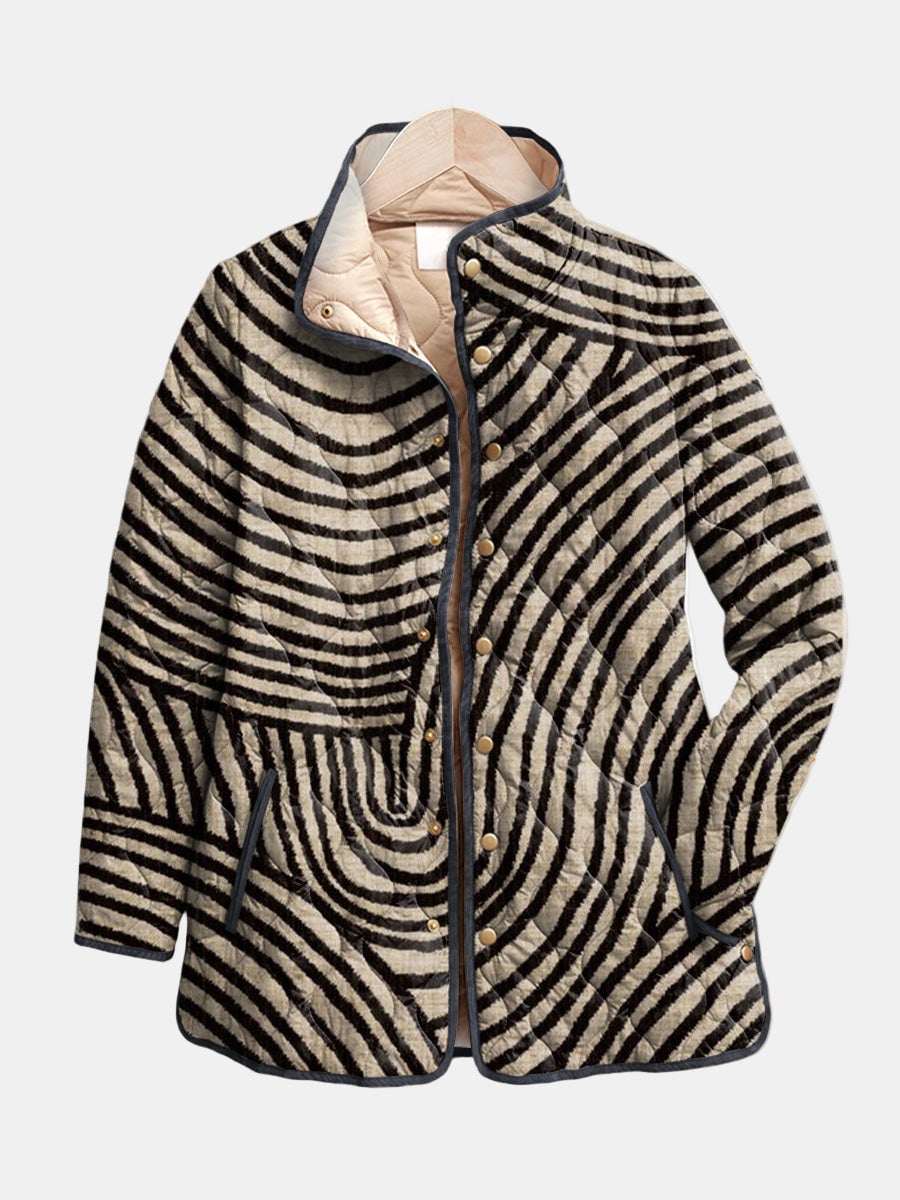 Woman wearing a multicolor retro circle quilted jacket with a relaxed fit and playful hand-drawn circular pattern