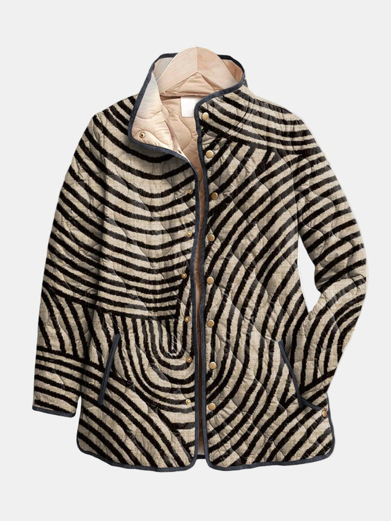 Woman wearing a multicolor retro circle quilted jacket with a relaxed fit and playful hand-drawn circular pattern