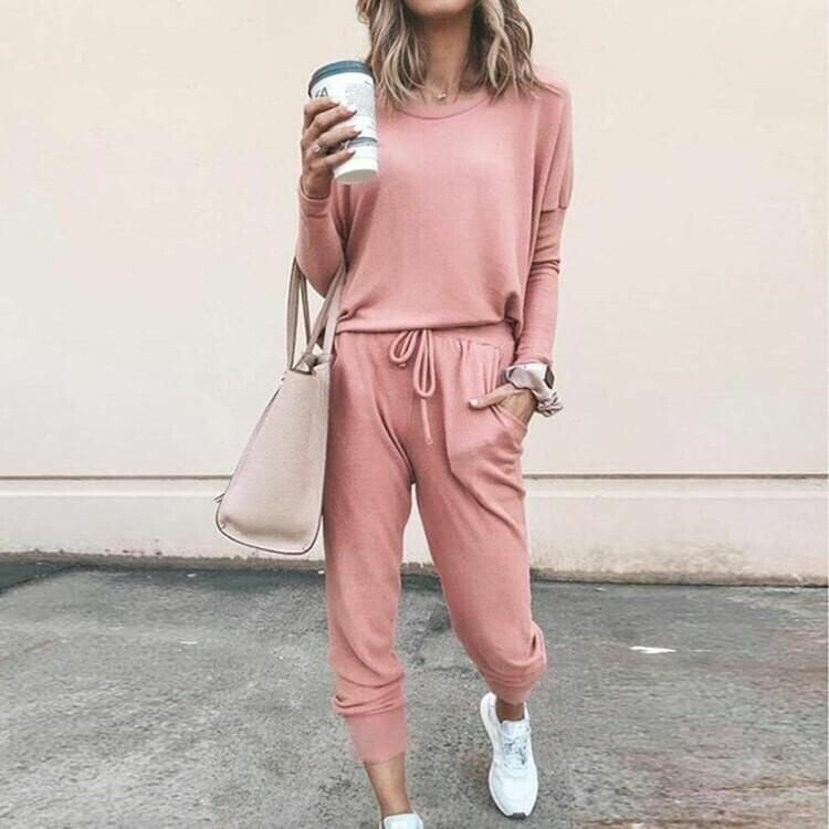 Model wearing a coordinated two-piece set in a solid color, featuring a flattering top and matching bottoms