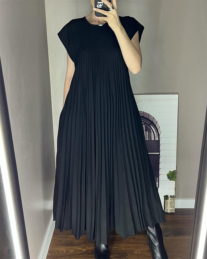 Front view of the Fern pleated maxi dress in black with elegant neckline detail