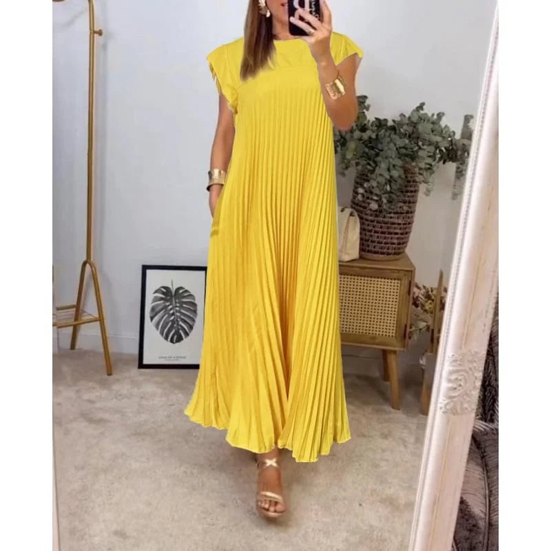 Full-length shot of the Fern flowy maxi dress in yellow against a neutral background