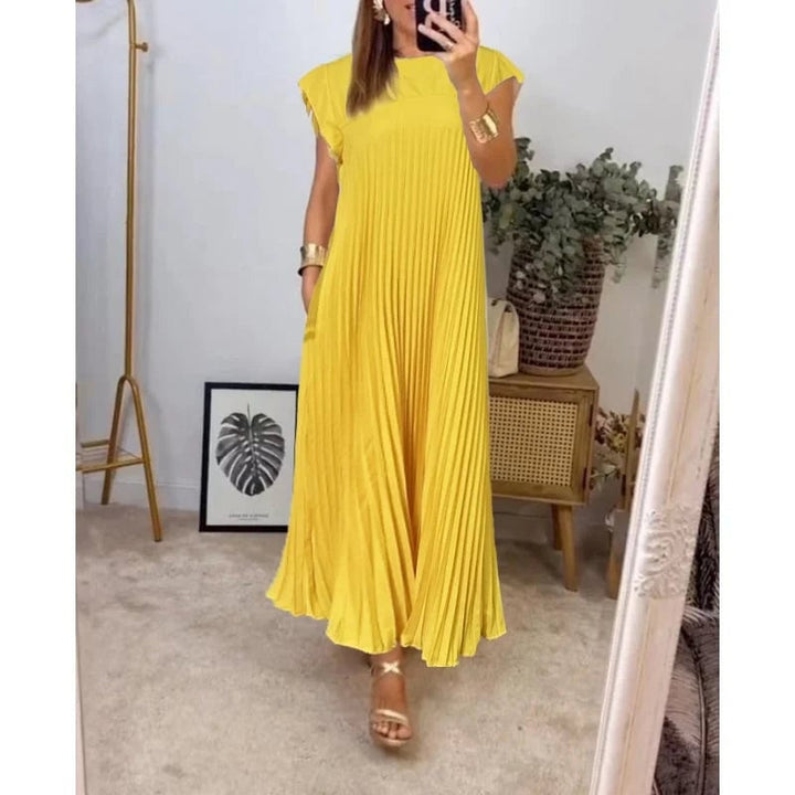 Full-length shot of the Fern flowy maxi dress in yellow against a neutral background