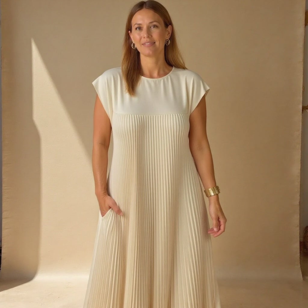 Woman smiling in the Fern flowy maxi dress in grey, styled for a cocktail occasion