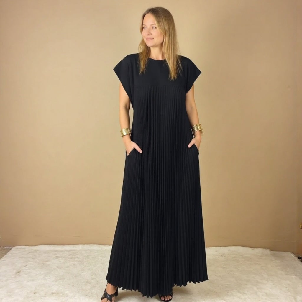 Back view of the Fern pleated maxi dress in brown showing the graceful drape