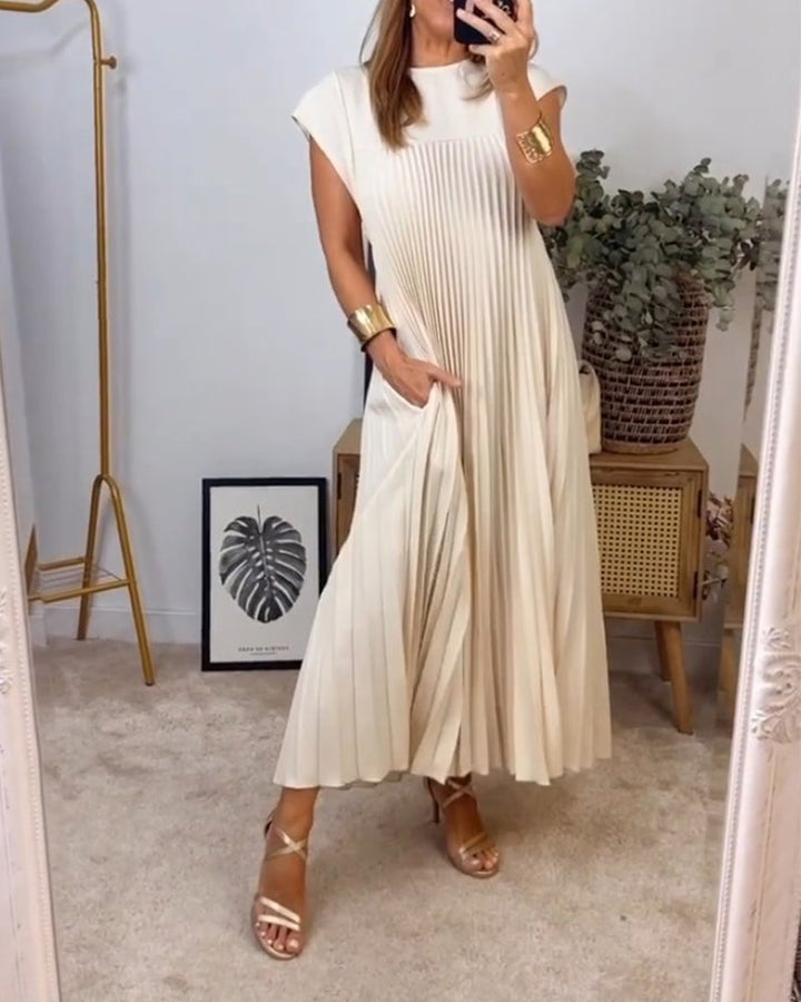 Side view of the Fern flowy maxi dress in yellow highlighting the waist definition