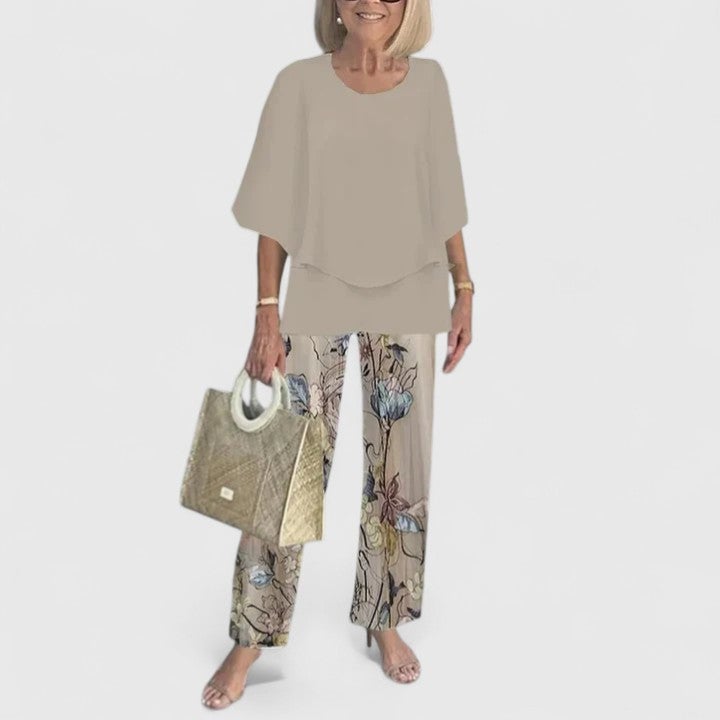 Front view of the Fern two-piece set in light gray featuring a batwing top and wide-leg botanical print pants
