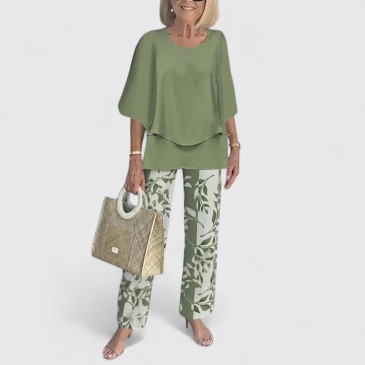 Back view of the Fern wide-leg pants set in light gray showing the flowing cape-style top drape