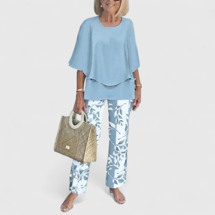 Model wearing the Fern two-piece set in pink with flowing wide-leg pants and batwing top