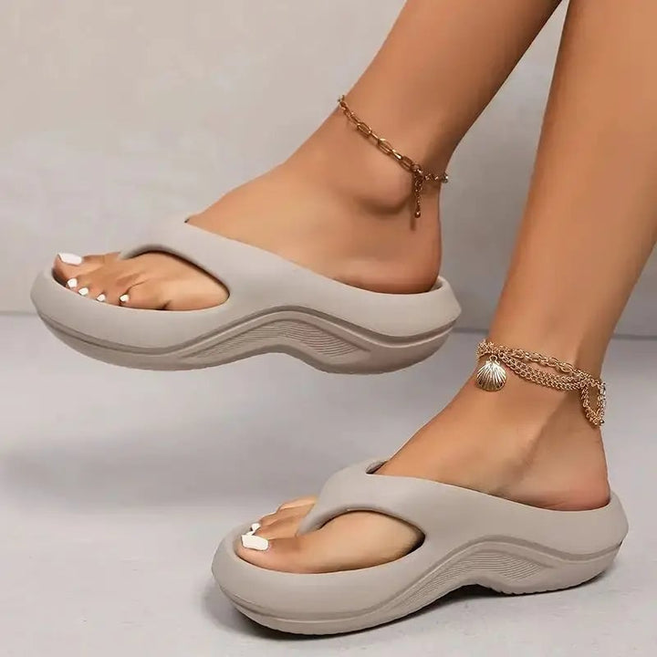 Finch women's cushioned flip flops in gray on a clean white background, showing the contoured footbed and soft strap
