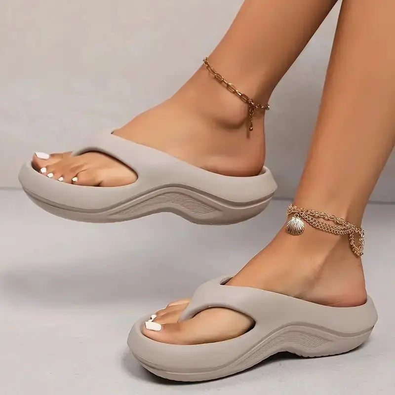 Finch women's cushioned flip flops in gray on a clean white background, showing the contoured footbed and soft strap