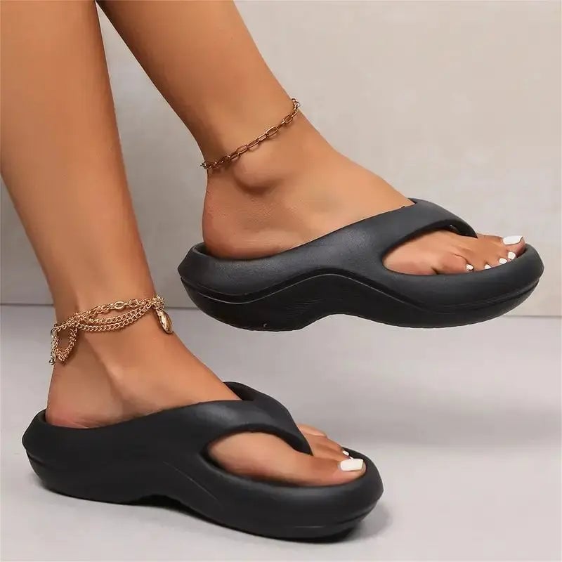 Flat lay of all three Finch flip flop color options: gray, white, and black
