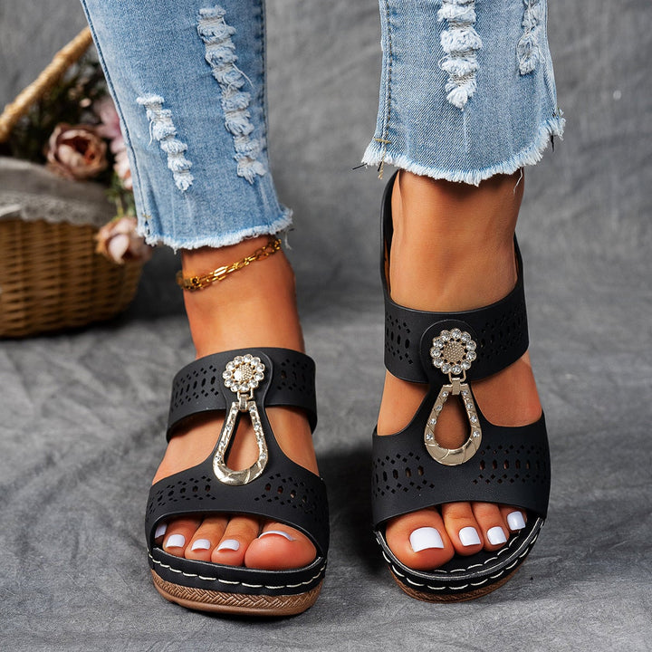 Side view of Finley khaki flat sandal highlighting adjustable ankle strap
