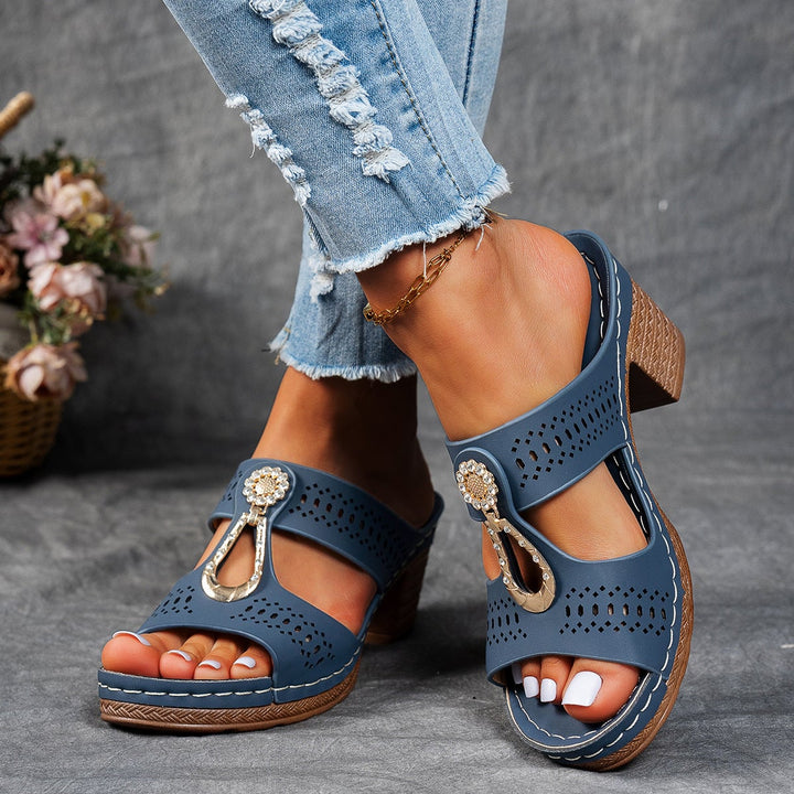 Close-up of sparkling rhinestone embellishments on Finley pink sandals