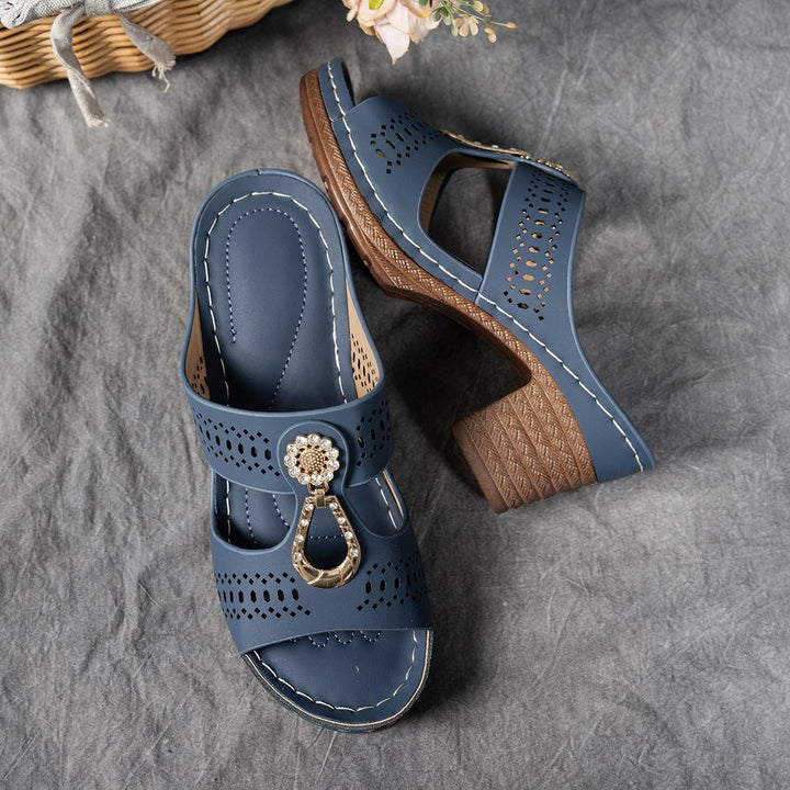 Side view of Finley pink flat sandal showing strap and sole construction