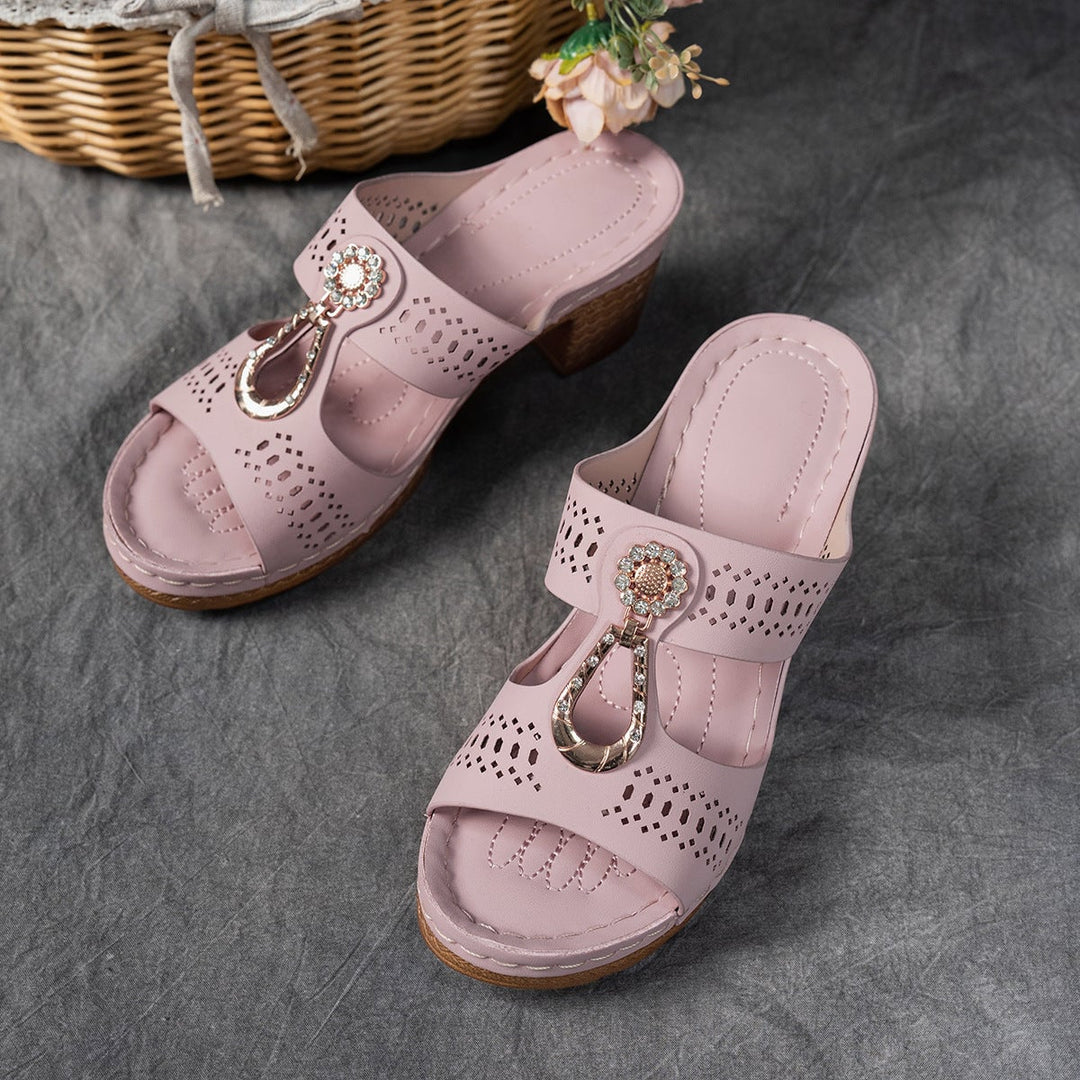 Finley pink flat sandals worn at an outdoor garden party setting