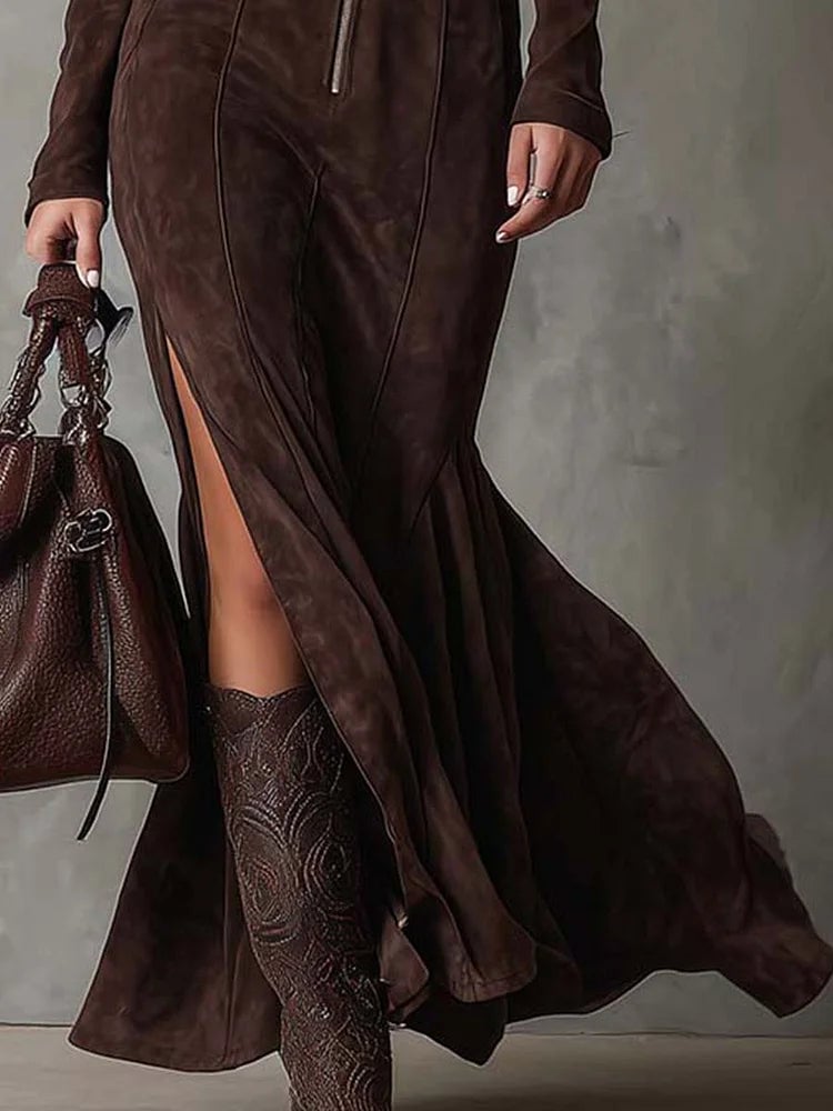 Close-up detail of the brown suede-effect maxi dress highlighting the soft velvety texture and belt styling