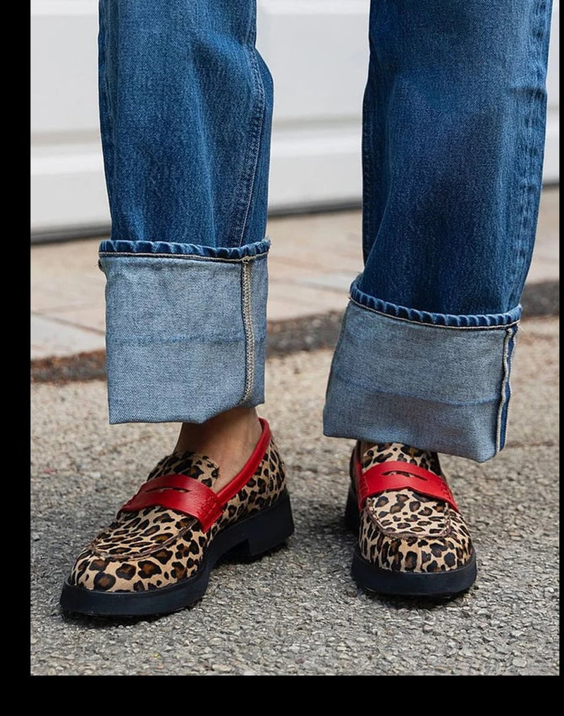 Brown and khaki accent loafers with sleek silhouette and distinctive detailing, shown from a front angle