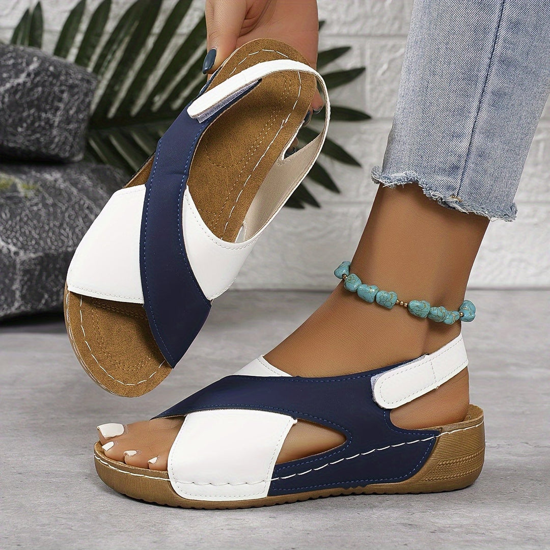 Flavia women's adjustable walking sandal in black, side profile view