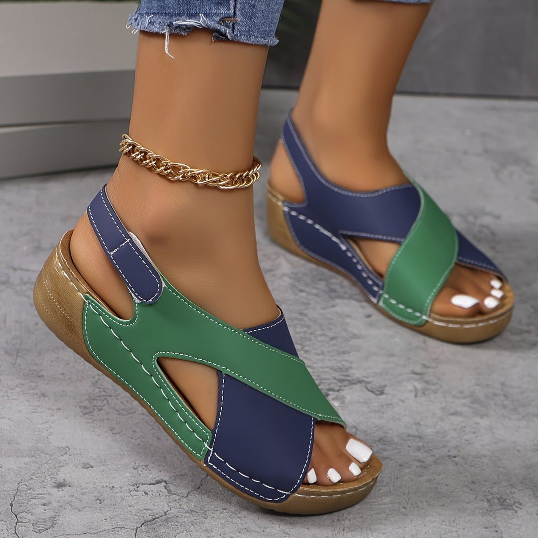 Flavia women's adjustable walking sandals in all four colors — blue, black, green, and orange