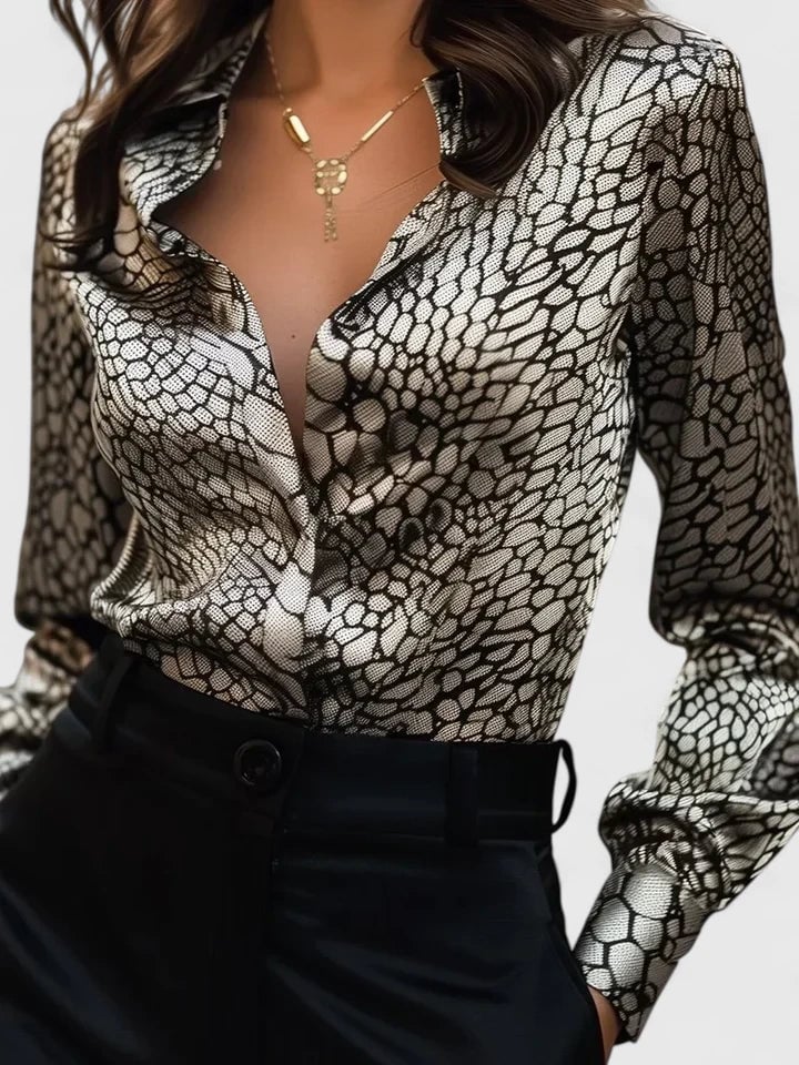 Front view of leopard print collared blouse with long sleeves in black