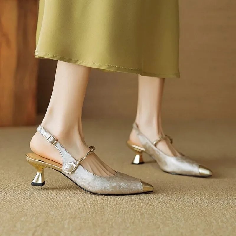 Close-up of pearl centerpiece on twisted ankle strap of Fleur kitten heel pumps