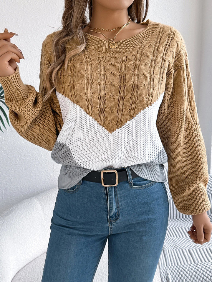 Chevron stitch pullover sweater in black colorway on a female model