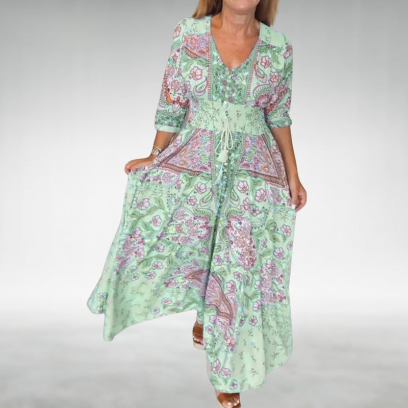 Close-up of the Flora maxi dress in green highlighting the soft drape and breathable fabric detail