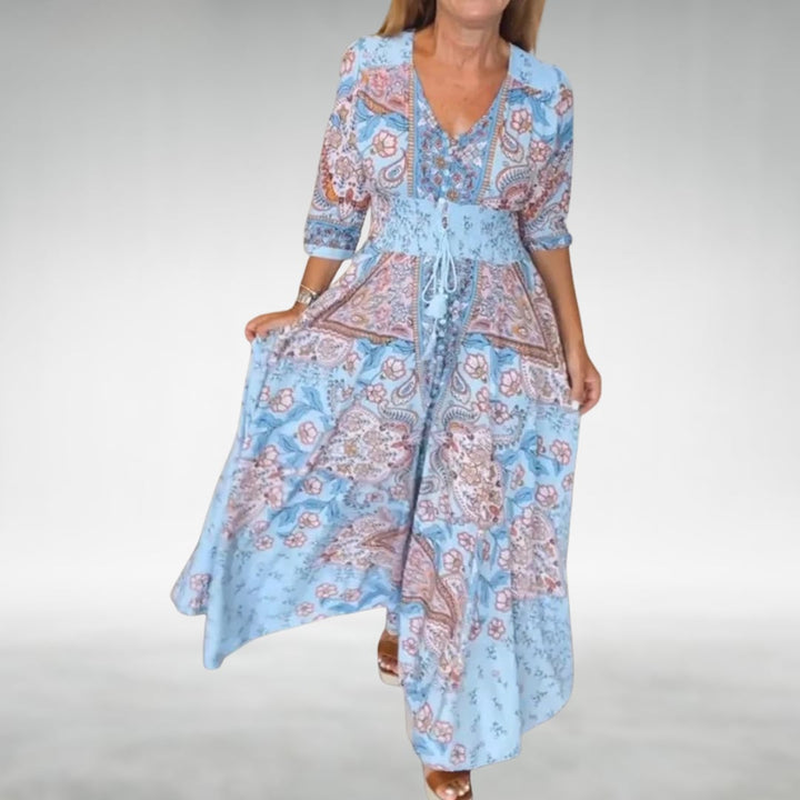 Front view of the Flora boho maxi dress in sky blue styled with sandals for a relaxed summer look