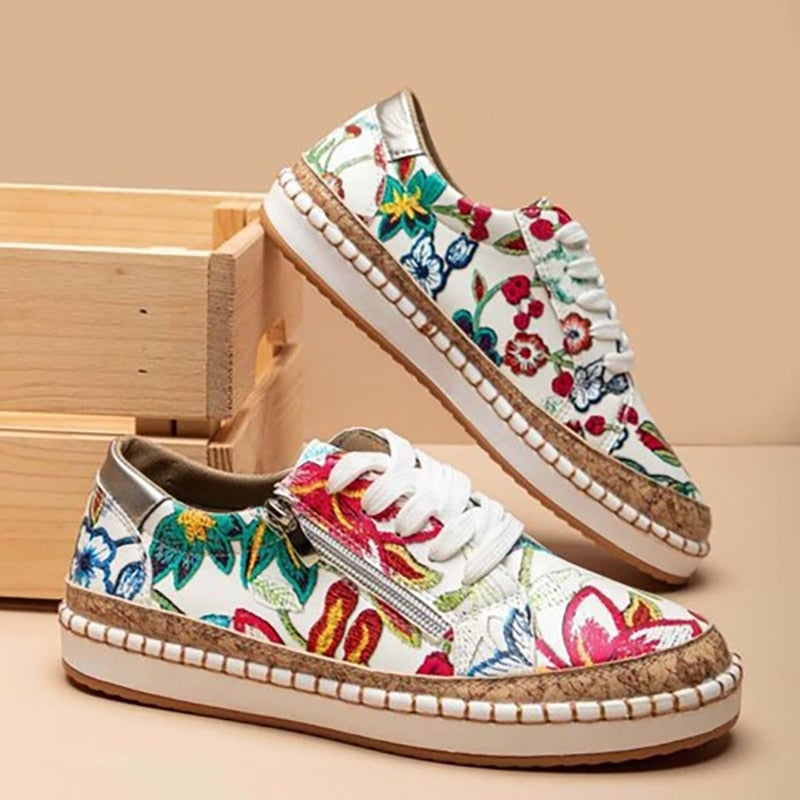 Women's floral embroidered lace-up sneaker with side zip and cork-style platform sole in red