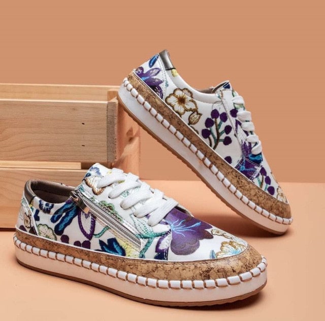Close-up of all-over floral embroidery detail on the Flora women's platform sneaker upper
