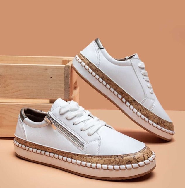 Flora floral embroidered sneakers styled with casual outfit, available in red, blue, black, and white