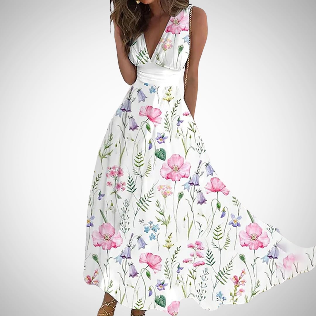Close-up of the Flora maxi dress ruched wrap waistband and flowing skirt in white and pink floral print