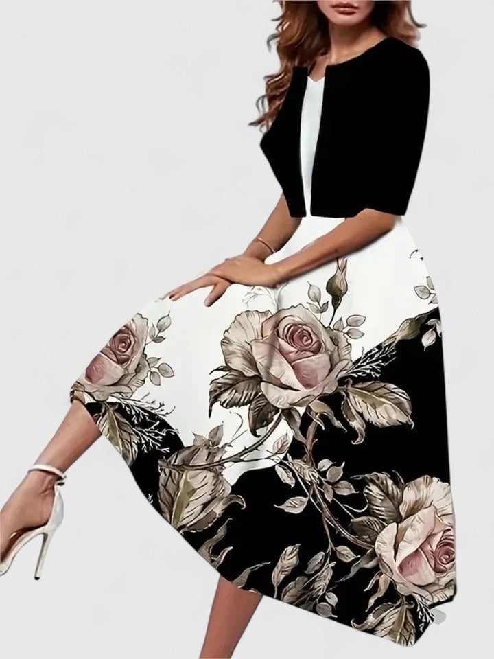 Flora floral midi dress in blue showing full A-line floral skirt with graceful movement