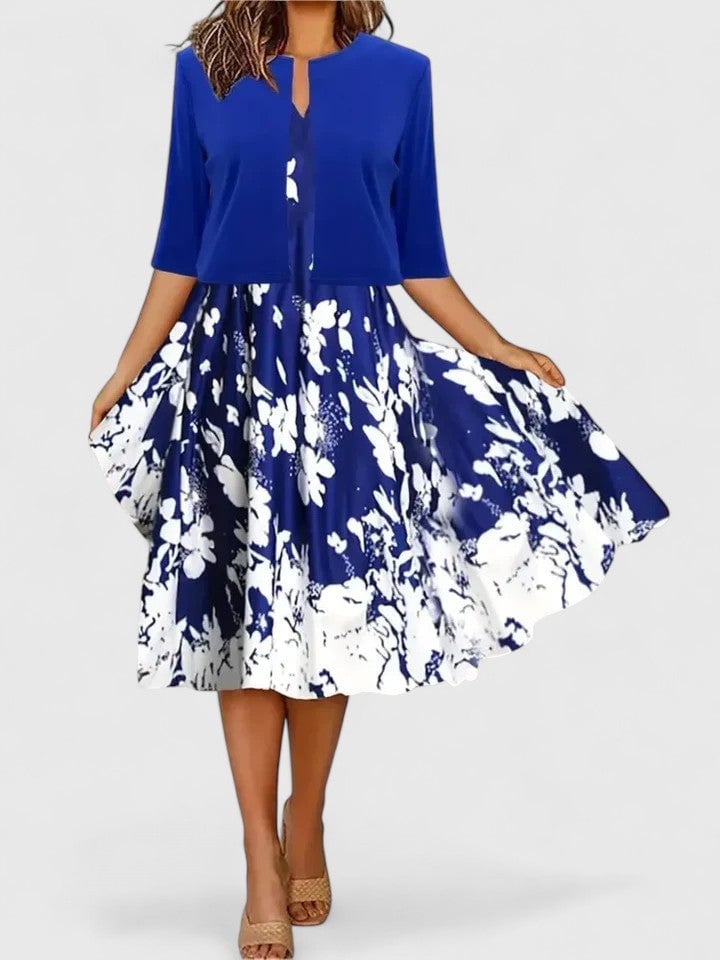 Flora floral midi dress in blue, back view showing clean A-line silhouette and 3/4 sleeves
