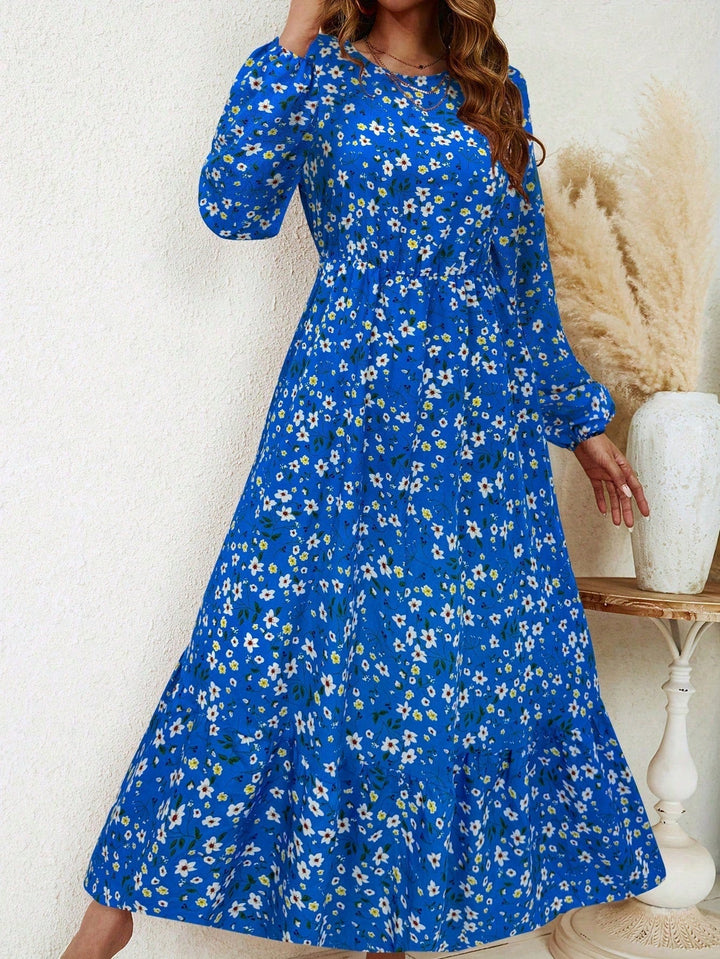 Front close-up of the smocked high waist and floral print detail on the Flora maxi dress in black