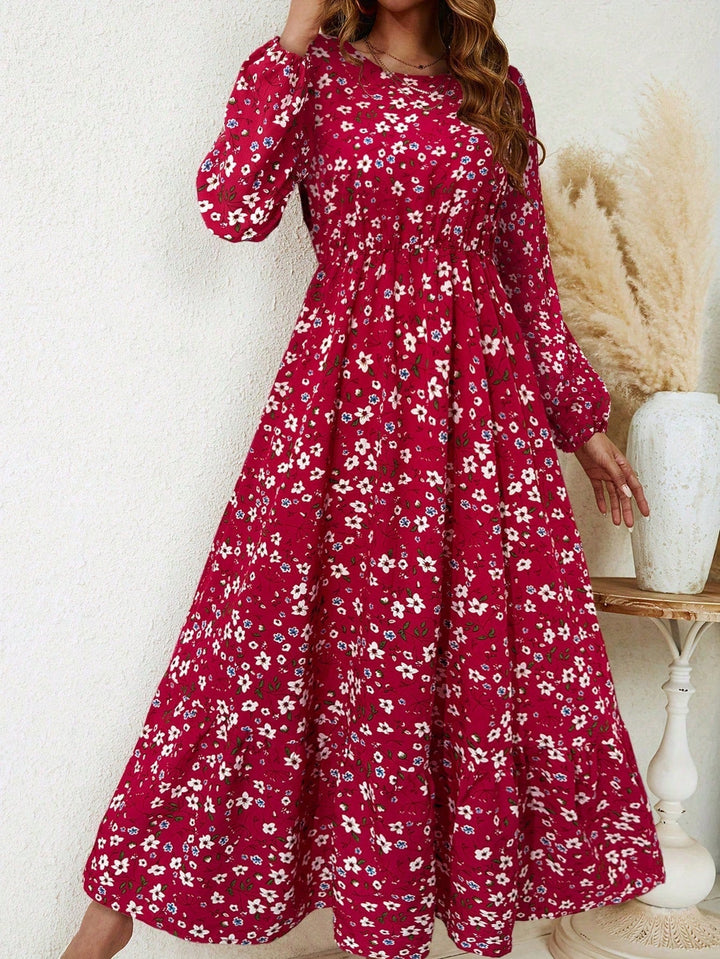 Back view of the black floral bishop sleeve maxi dress highlighting the smocked waistband