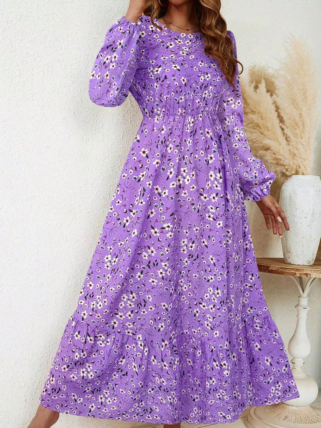 Flora maxi dress in pink floral print, front view showing smocked waist and flowing skirt