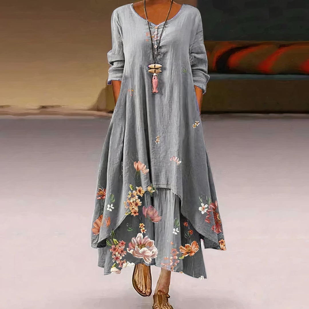 Woman wearing a red floral print long sleeve maxi dress, full-length front view