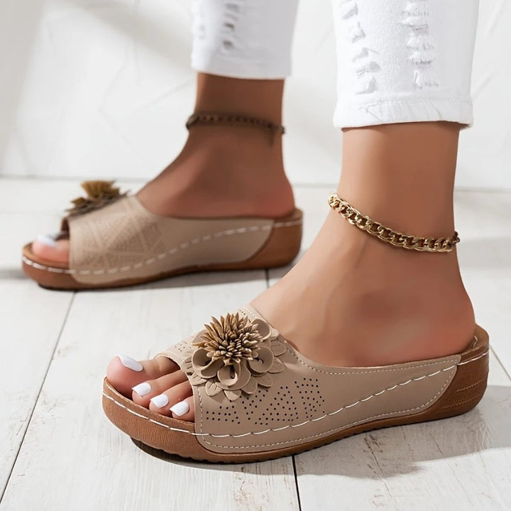 Flora flower wedge sandals in white, front view showing open toe and floral detail