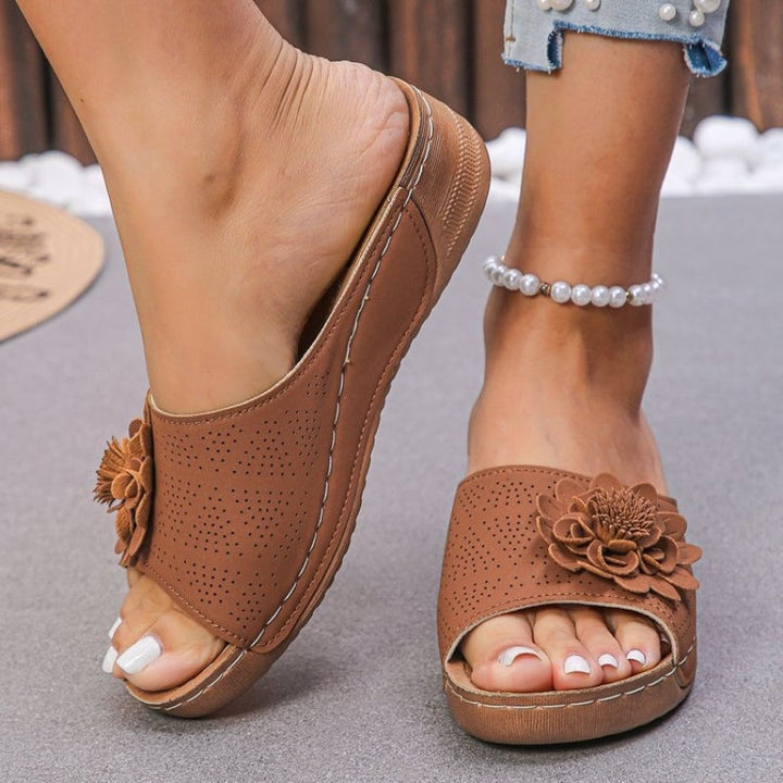 Flora wedge slides in khaki with sculpted flower appliqué, side profile view