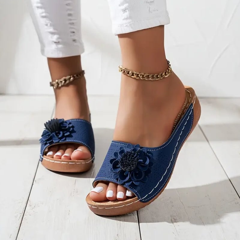 Flora flower wedge slides styled with a flowy summer dress, lifestyle shot