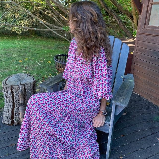 Side view of Flora boho maxi dress in purple showing flowing maxi skirt movement