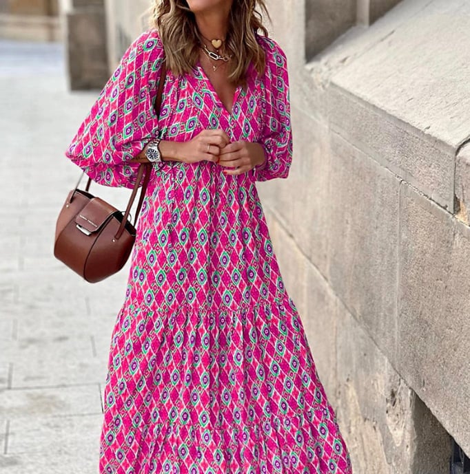 Flora boho maxi dress in light green showing geometric print and flowing hem