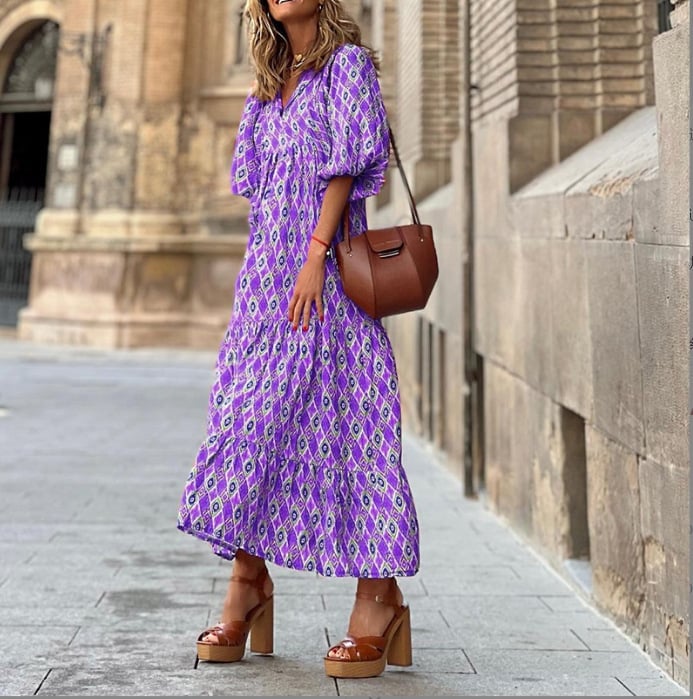 Model wearing Flora boho maxi dress in light green, side profile view