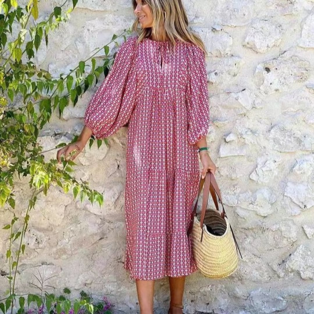 Flora boho maxi dress in pink with geometric print and tie-neck V-neckline