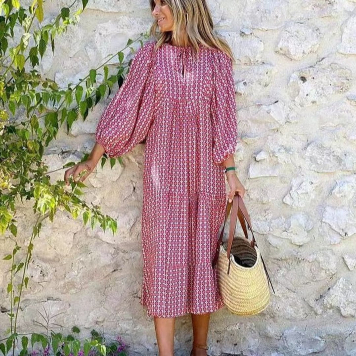 Flora boho maxi dress in pink with geometric print and tie-neck V-neckline