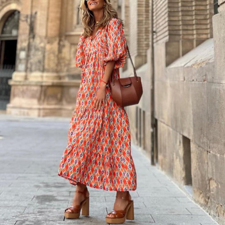 Full-length view of Flora boho maxi dress in pink on smiling model